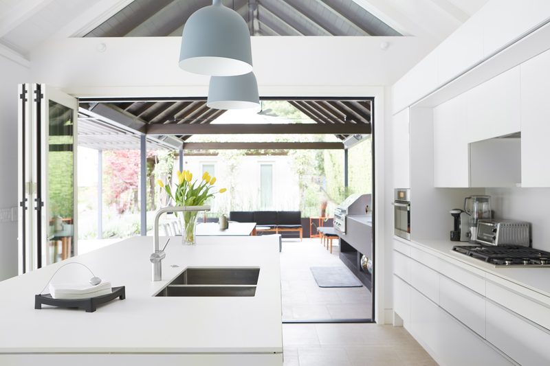 Guest kitchen opening to outdoor entertaining