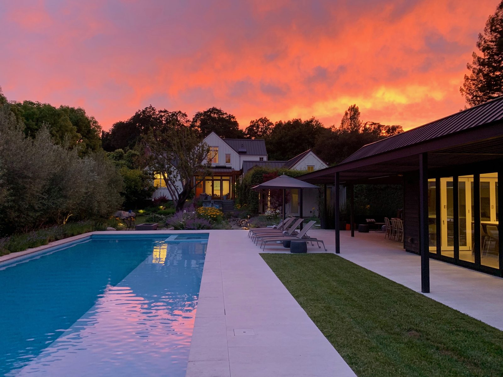 Property at sunset with pool reflection